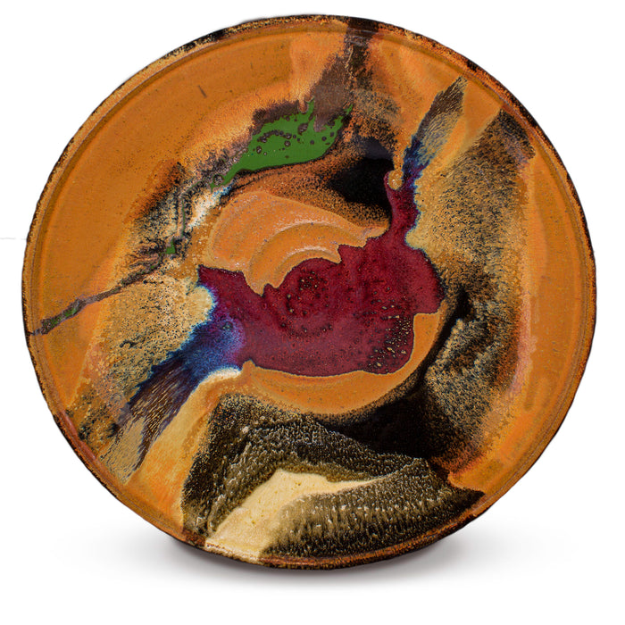 13 inch wheel-thrown stoneware bowl accented with vibrant red, green, and purple-blue colors.  Handmade pottery by Prairie Fire Pottery.  Overhead view.