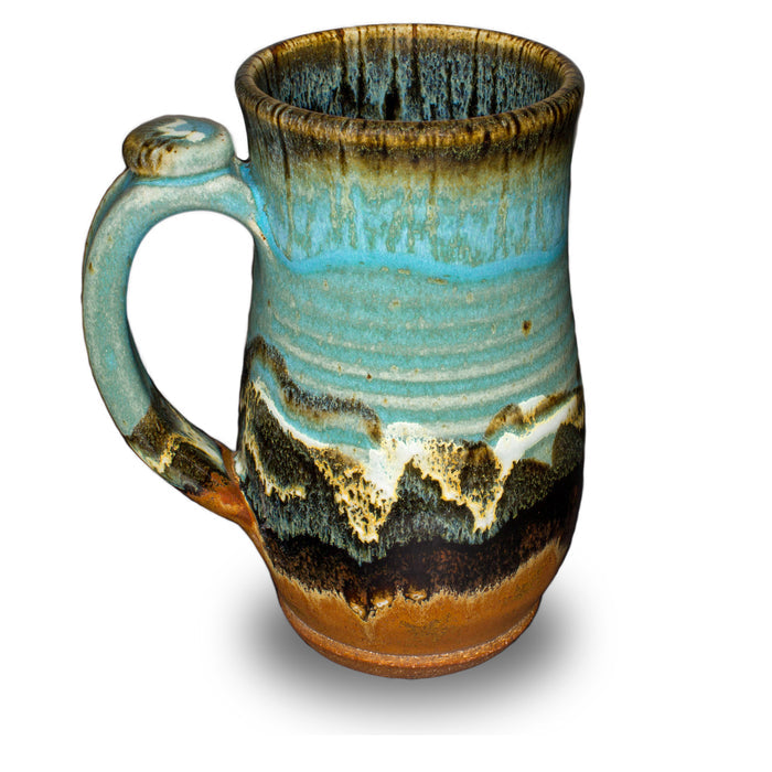Handmde 20 ounce pottery mug.  Turquoise and brown colors.  Hand made by Prairie Fire Pottery.  Left side view.