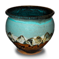 Soft turquoise and brown colors on a 7 inch handmade pottery spoon crock. Hand made by Prairie Fire Pottery. Hand crafted in stoneware clay and made in the U.S.A.