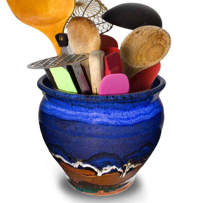7 inch spoon crock in cobalt blue & brown . Hand made from stoneware clay. Handmade pottery by Prairie Fire Pottery.  View of cooking utensils inside the crock.
