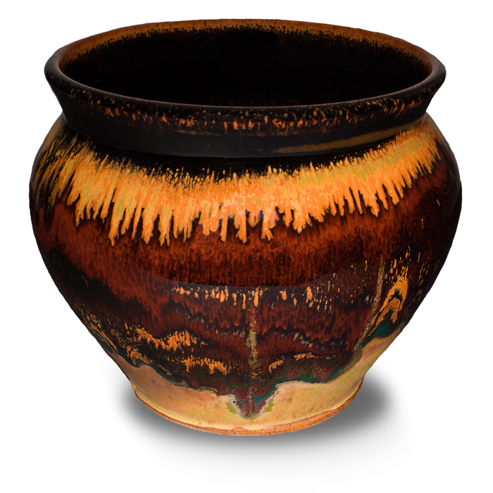 Beautiful toasted orange colors over red on a handmade pottery spoon crock. Hand made by Prairie Fire Pottery.