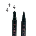 Two black Sunset Makeup ankh stamp eyeliner applicators displayed on a white background with a black ankh stamp impression.