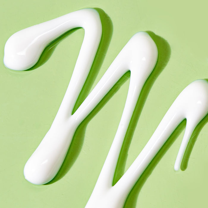 texture shot of cleansing comfort balm on green background