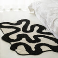 Black Swirl Shaped Area Rug