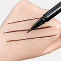 Sunset Makeup brown felt-tip eyeliner with three precise brown line swatches on a hand.