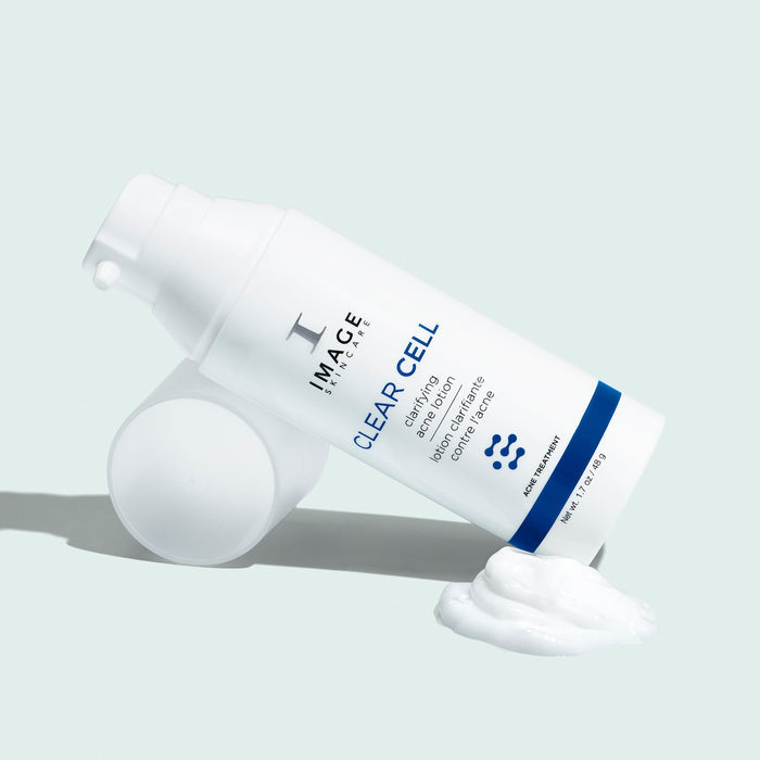 clear cell acne lotion bottle on lotion swatch