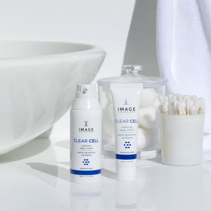 CLEAR CELL clarifying repair crème retail and travel size on bathroom counter
