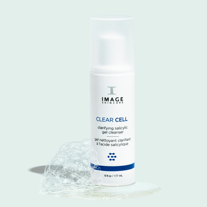clear cell cleanser retail size on blue background with bubbles