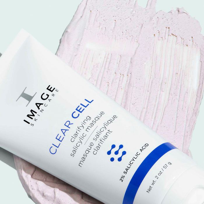 clear cell salicylic masque bottle on texture swatch of masque