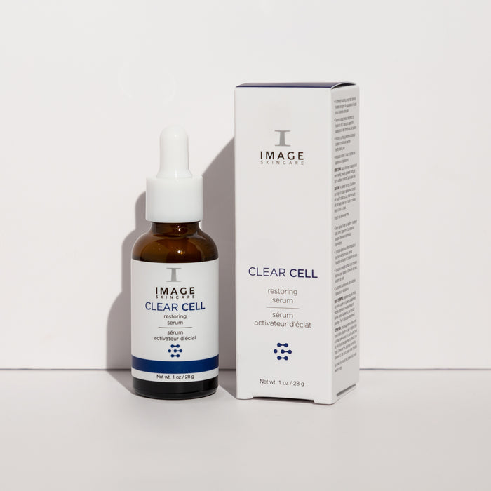 clear cell restoring serum bottle and packaging box on white background