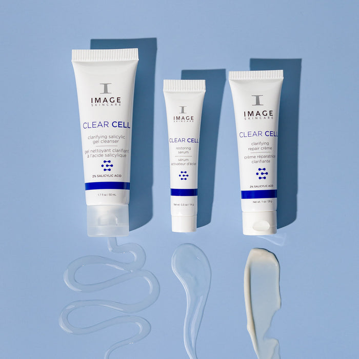 clear cell salicylic cleanser, restoring serum , and  repair creme travel size products on blue background with product swatches below each product