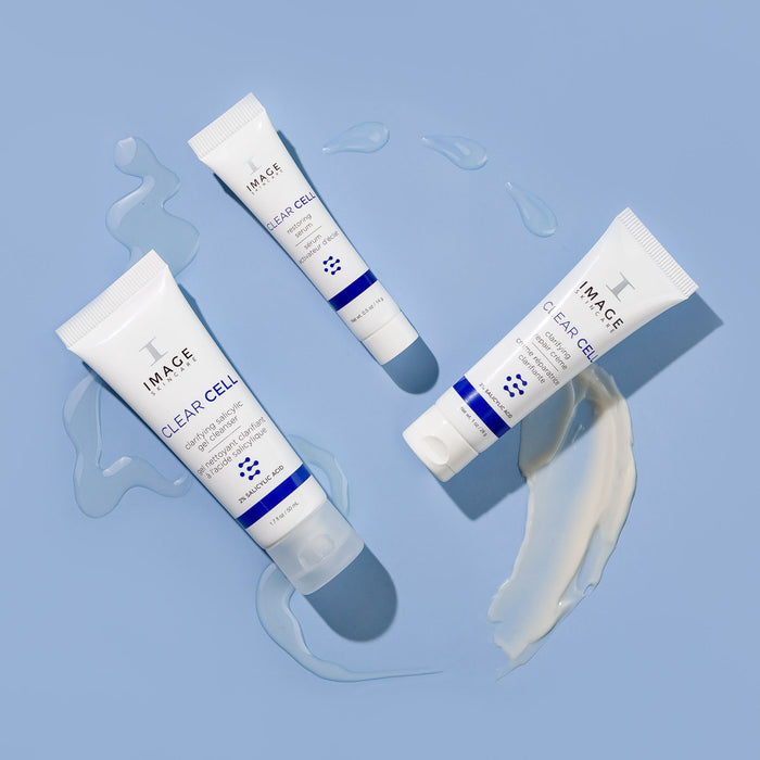 clear cell salicylic cleanser, restoring serum , and  repair creme travel size products on blue background with product swatches below each product