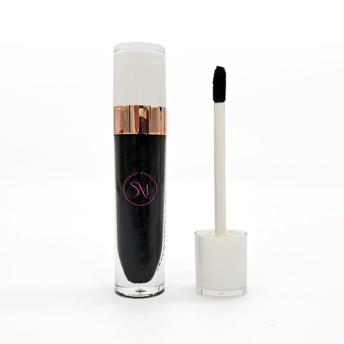Black matte liquid lipstick with applicator on a white background