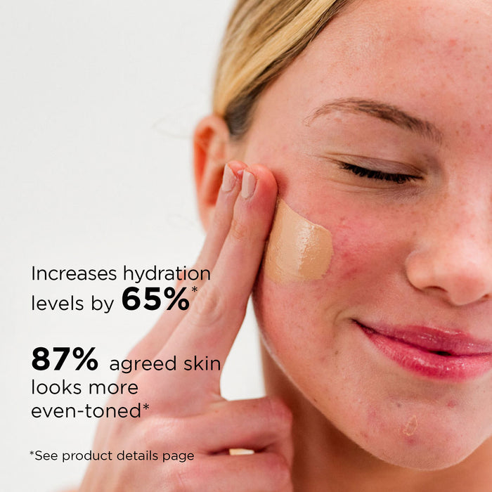 Woman applying IMAGE Skincare Daily Prevention Pure Mineral Tinted Moisturizer SPF 30, demonstrating the product's effectiveness in increasing hydration and promoting even-toned skin.