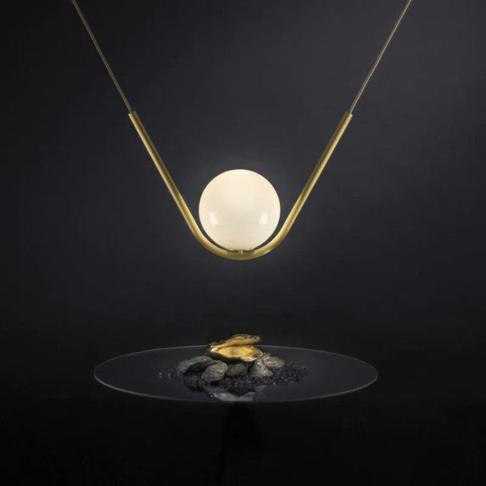 Harmony Glass & Brass pendant with plated brass curved bar and 15cm frosted globe 50cm width