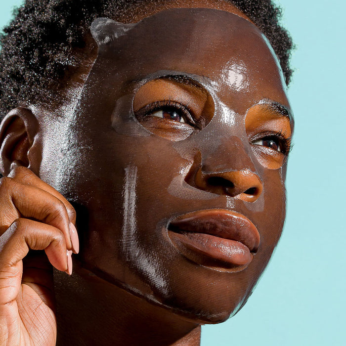 model with sheet mask on her face