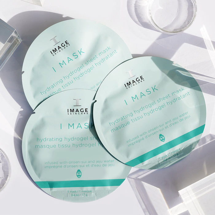 3 sheet masks in packaging on white background