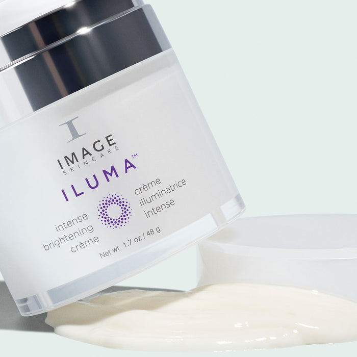 iluma brightening creme container on top of texture swatch