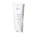 White skincare tube labeled 'ILUMA' on a white background