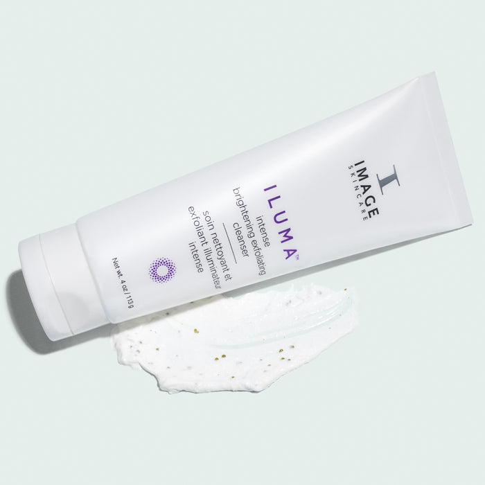 iluma cleanser retail size tube laying on product texture swatch