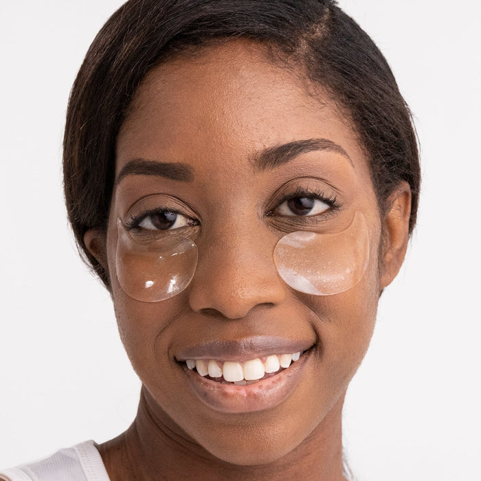 A woman wearing the hydro-gel eye masks