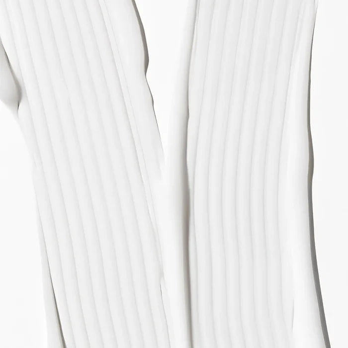Close-up of white fabric with a subtle pattern
