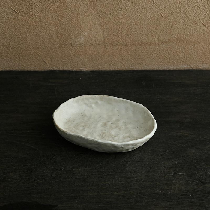 abstract round stone textured white ceramic bowl