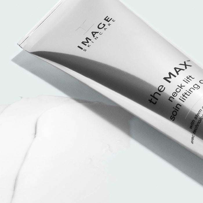 close up of the max neck lift product tube on texture swatch