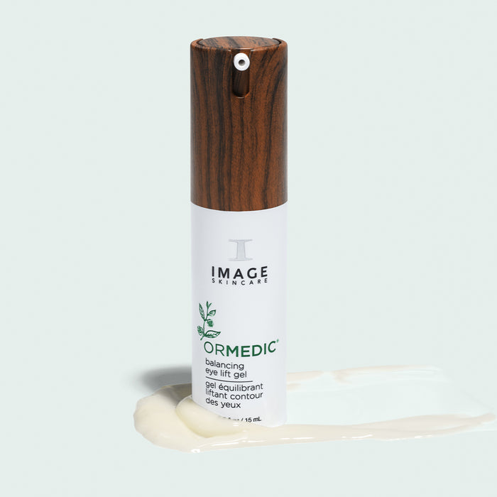 ormedic balancing gel lift product bottle placed on top of eye lift gel product swatch on light background