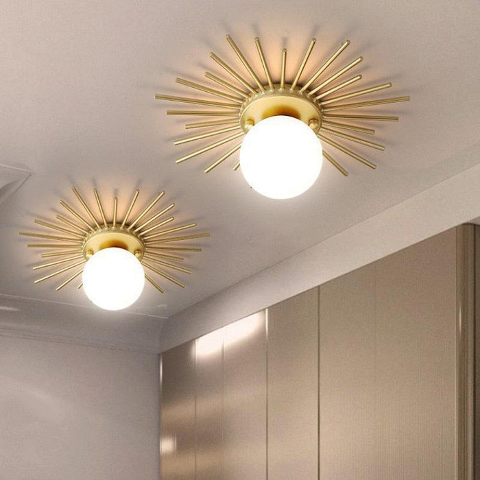 Sun Rays Glass & Gold Ceiling Lamp with frosted glass globe iron gold radial rods flush mount 9.9 x 3.8 in
