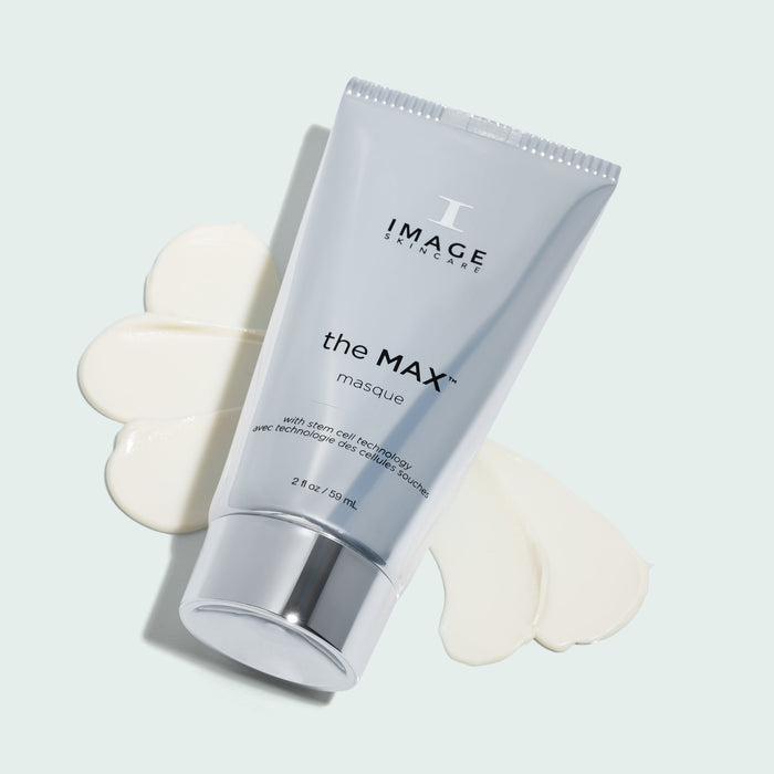 Max masque tube laying down on texture swatch on light background