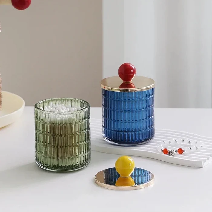 Textured glass canister with colorful knob and metal lid storage jar